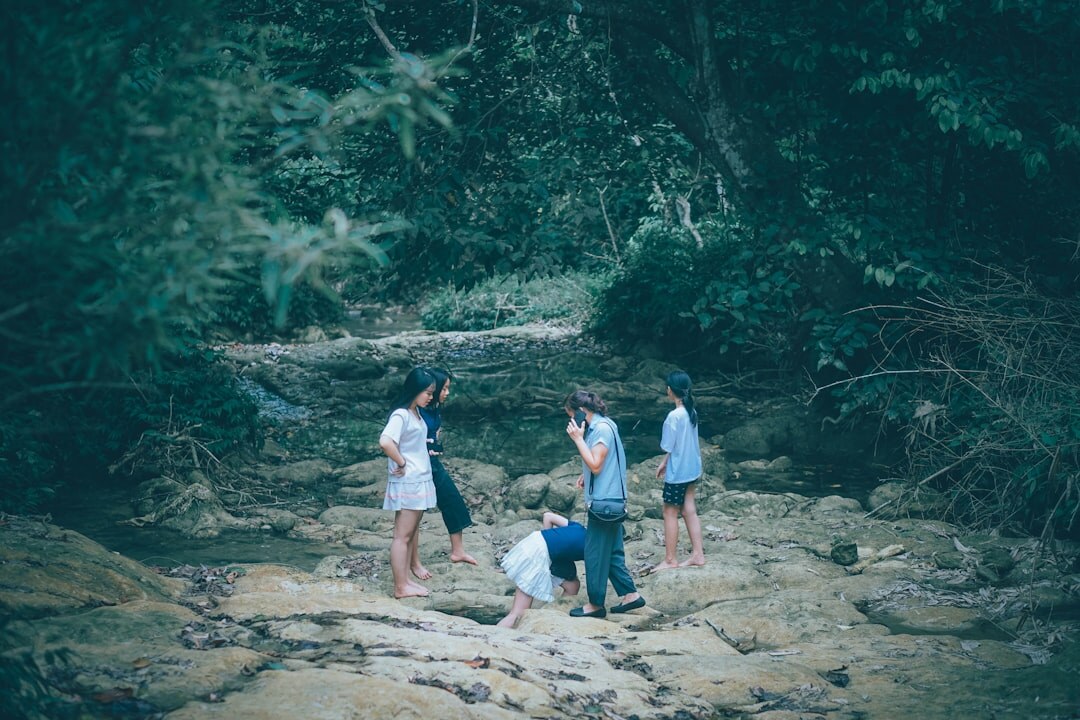 volunteers cleaning river bank